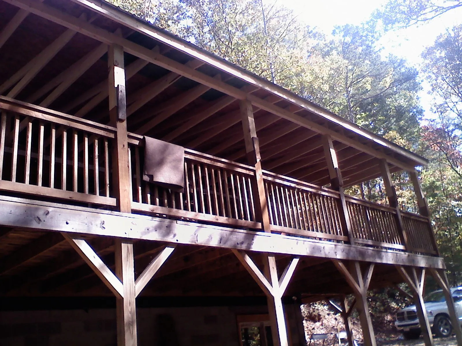 Timber framing under a new elevated porch and deck — Roof Leak Repair in Baldwin City by Roofing Brothers